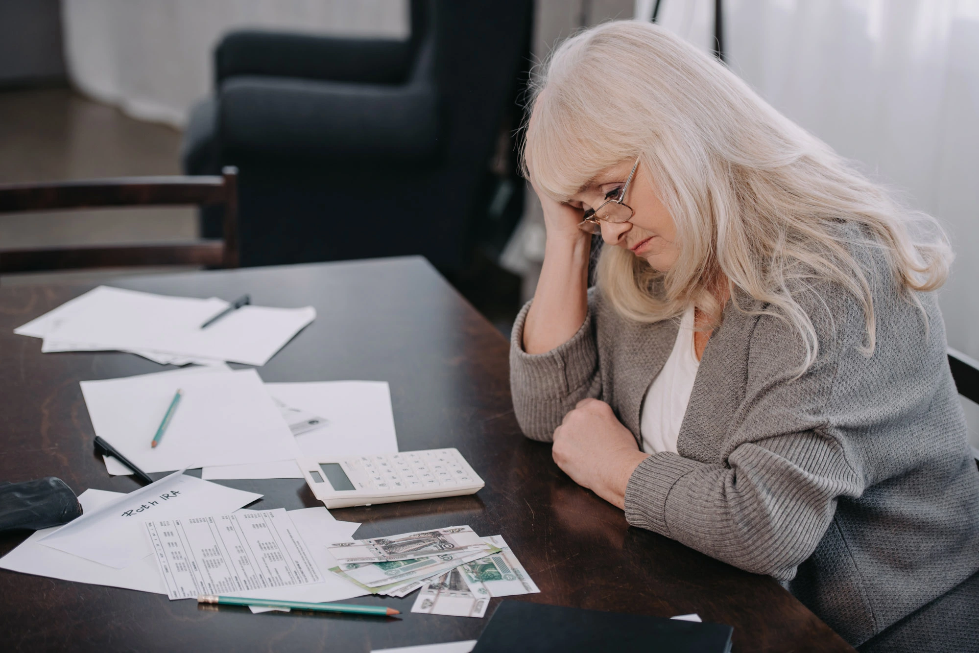 vulnerable person falling victim to spending their portfolio on a fake website, loosing all their sales money